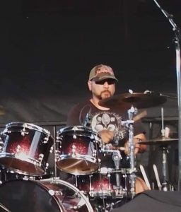 Chris playing drums at Oliver Music In The Park