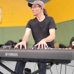 Ryan Schick playing piano at Osoyoos Music In The Park